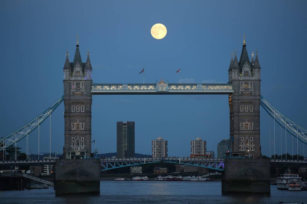 A supermoon rises over Tower Bridge
