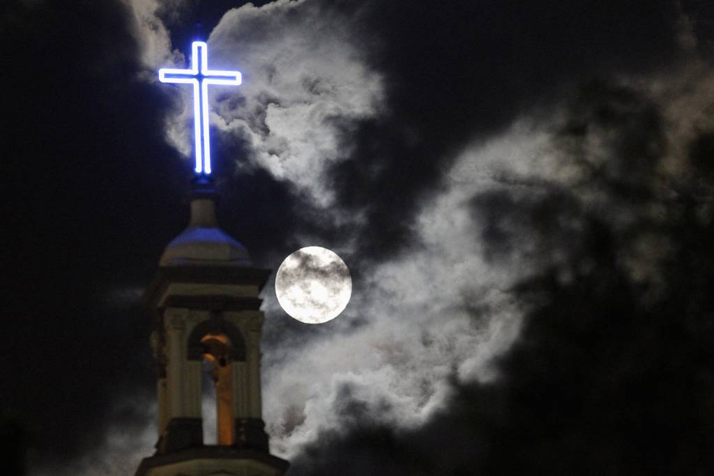 A supermoon rises over the dome of the Metropolitan Cathedral in Monterrey, Mexico
