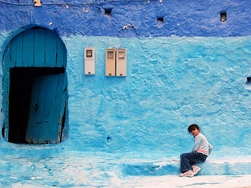 Girl sitting at Chefchaouen Morocco