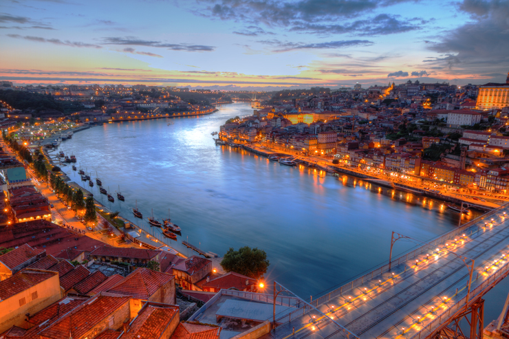 Porto City Portugal lighted famous bridge Ponte dom Luis above Old town Porto and river Duoro at night, Portugal