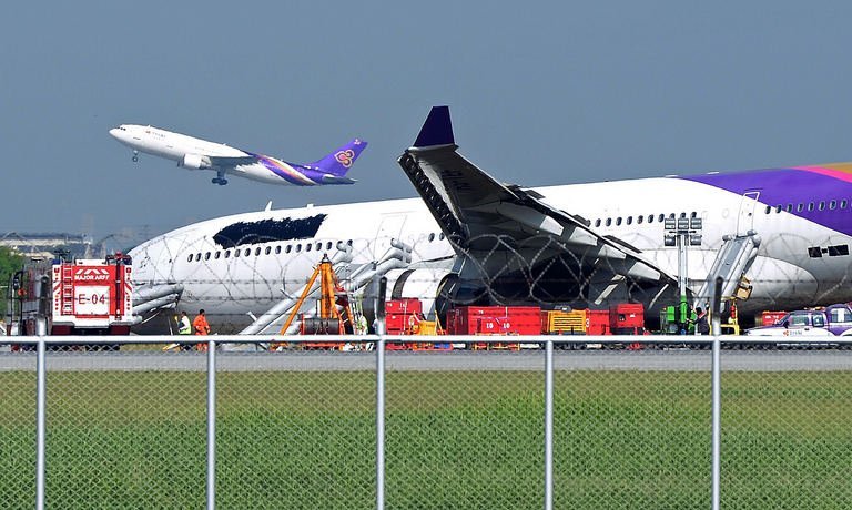 Thai Airways Plane Skidsoff Thai Airways Plane Skidsoff the runway