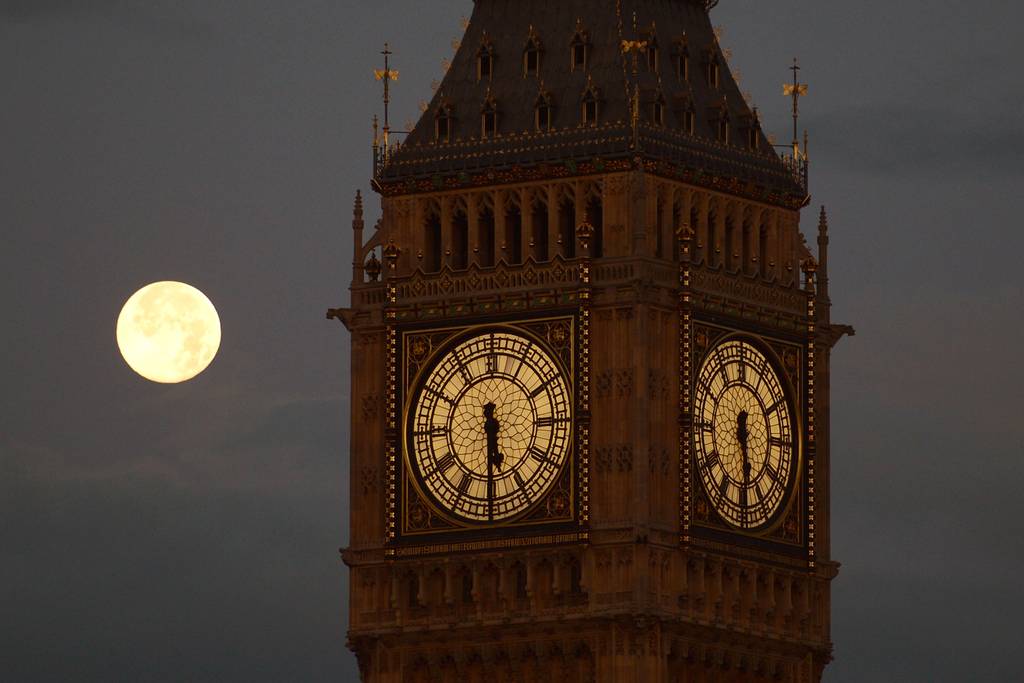 The moon lurks behind Big Ben