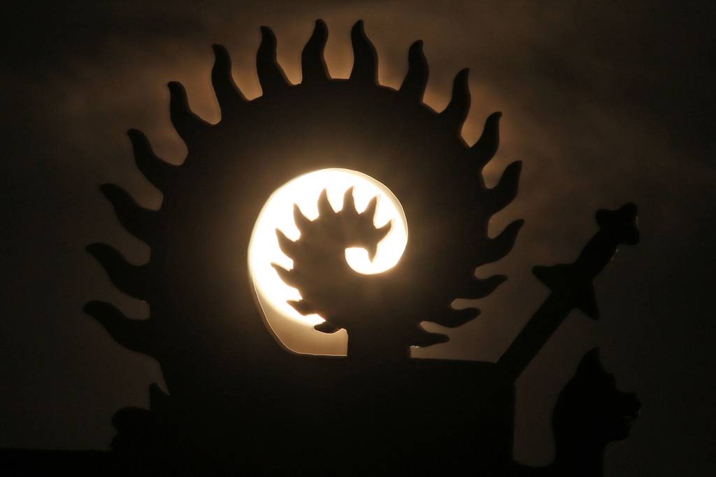 The supermoon seen through a statue in Jilin, northeast China